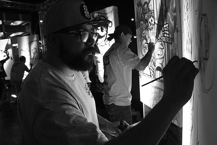 Albert F. Montoya Jr. drawing live artwork